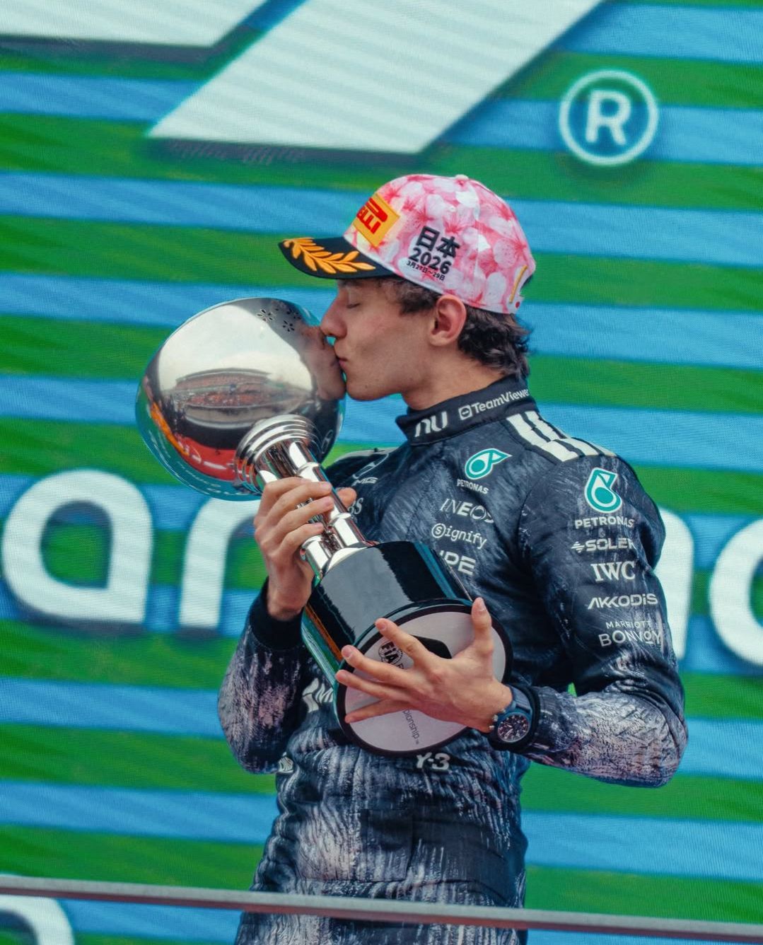 Kimi holding trophy