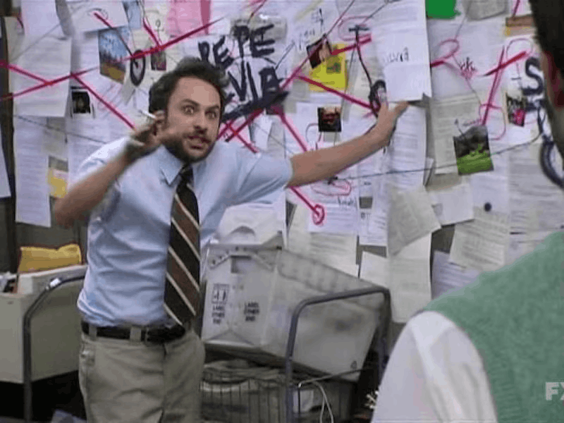 Charlie pointing at the crazy map from IASIP